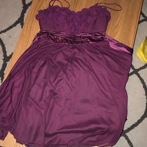 Fancy purple dress with floral neckline.
